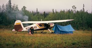 Cessna 120 waiting out weather along the Alaska-Canada highway, 1974